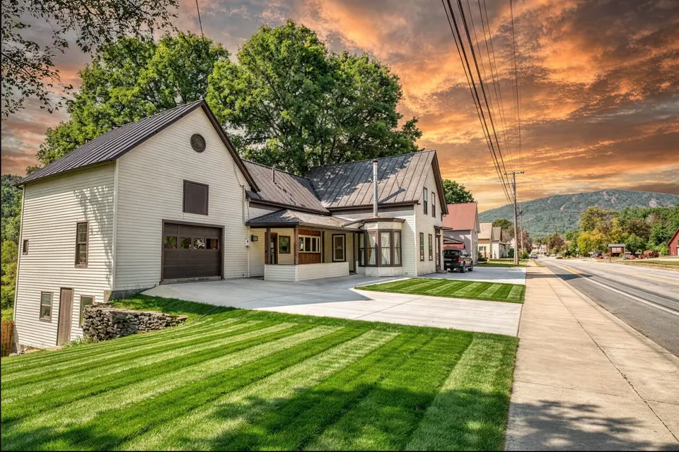 The Bear's Den at 56 Main Street, Ludlow, Vermont — exterior at golden hour
